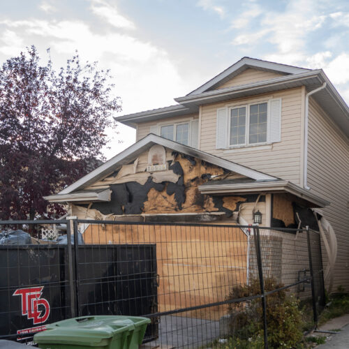 Calgary, Alberta, Canada. Oct 10, 2023. A neighborhood garage roof, which bears the scars of recent accidental fire damage, expertly extinguished by firefighters.